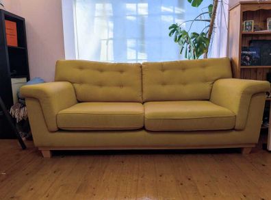 Stylish yellow couch / sofa