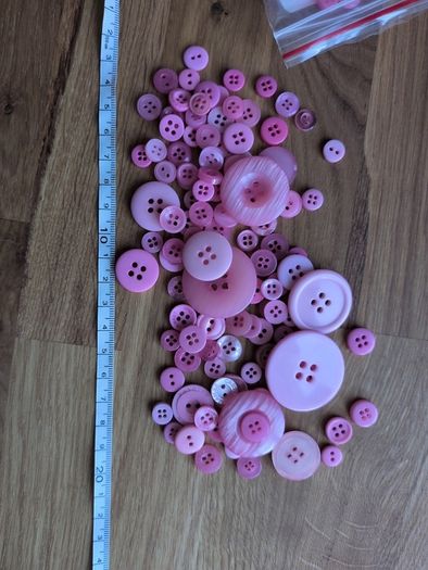 Pink plastic buttons