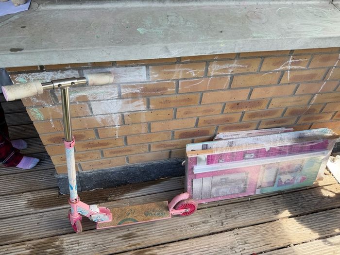 Child scooty and disassembled doll house