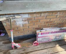 Child scooty and disassembled doll house