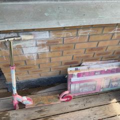 Child scooty and disassembled doll house