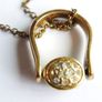 Vintage necklace features a polished, knocker-shaped pendant  gold plated, centered with an iridescent turquoise Spinning Fob Image 10