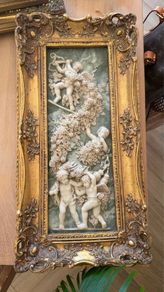 Antique carving in gilt frame