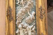 Antique carving in gilt frame