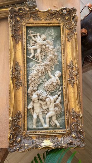 Antique carving in gilt frame