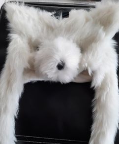 New white fur hat tag attached