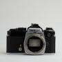 Beat up Nikon FE and Nikkormat cameras