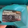 The Makita GA004G 115mm 40V XGT grinder with battery and charger Image 4