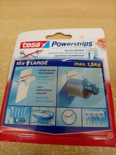 A pair of wall frames. Never used + Tesa power strips (x 10)