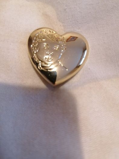 the variety club child's face brooch.