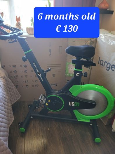 Tv, table, shelves, chair, excersize bike, armchair