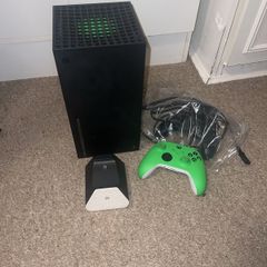 Xbox series x, 2 controllers and rechargeable battery pack& charger stand