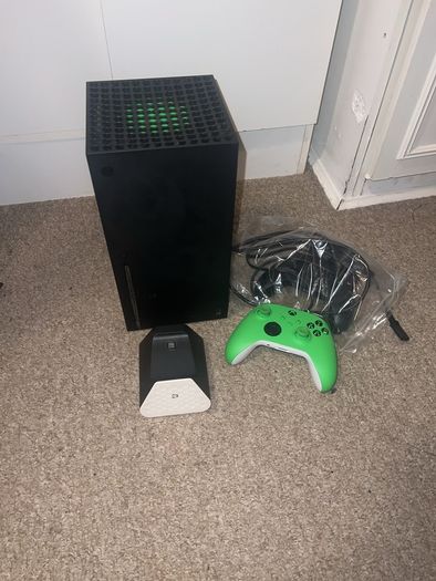 Xbox series x, 2 controllers and rechargeable battery pack& charger stand