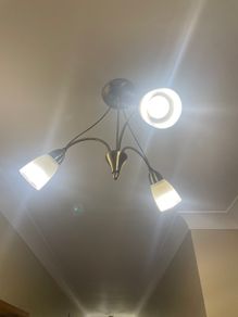 Semi-flush antique brass ceiling  light fitting with 3 frosted glass shades.