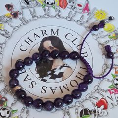 Thomas Sabo purple gemstone beaded charm carrier bracelet made with natural amethyst beads and an adjustable purple cord.Lovely condition