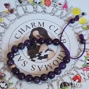 Thomas Sabo purple gemstone beaded charm carrier bracelet made with natural amethyst beads and an adjustable purple cord.Lovely condition