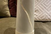 Tall white vase for flowers with house detail
