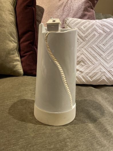 Tall white vase for flowers with house detail