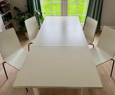 IKEA BJURSTA extendable dining table with 4 white dining chairs