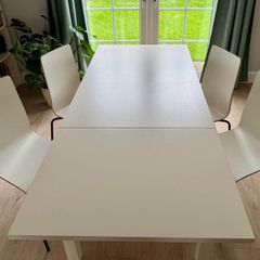 IKEA BJURSTA extendable dining table with 4 white dining chairs