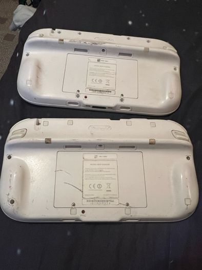 A pair of faulty Wii U game pads.