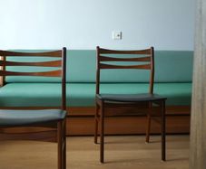 A pair of mid-century teak Danish dining chairs
