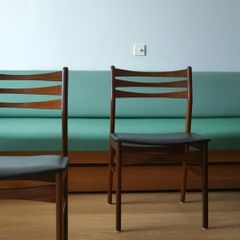 A pair of mid-century teak Danish dining chairs