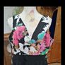 Ladies Jumpsuit black with flowel detail on the top. Image 4