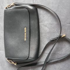 Michael Kors black crossbody bag with adjustable shoulder strap and gold-tone hardware. In great condition, only some colour fading on the logo, as shown in the photos.
