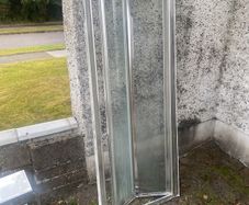 Bi-folding shower door