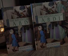 The Adventures of Abdi ! by Madonna ! Illustrated by Olga and Andrej Duda ! 2004 ! by Puffin Books !