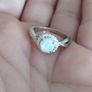 A beautiful 925 silver ring with a white lab opal surrounded by shining cubic zirconia. Image 8