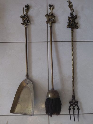 Antique French fireplace set 1950s features handles with various figures with animal finials