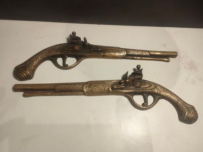 A pair of Early 20th Century 13" Brass Flintlock pistols