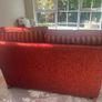 Red and gold 2 seater reversible print sofa Image 4
