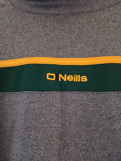 O'Neills Meath GAA Zip Top. Age 13. Width 47cm, Length 54cm. Very Good Condition. Price Includes Postage.