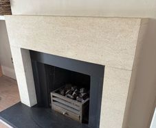 Sandstone fireplace and hearth