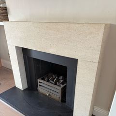Sandstone fireplace and hearth