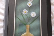 Framed arrangement of plastic flowers