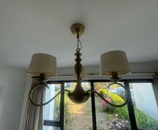 Two antique brass chandeliers - cream shades.