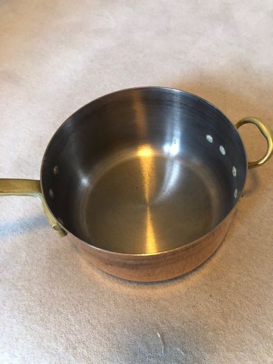 Vintage castle copper saucepans