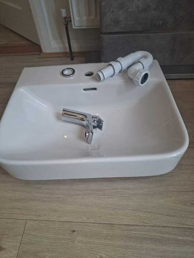 Basin with tap