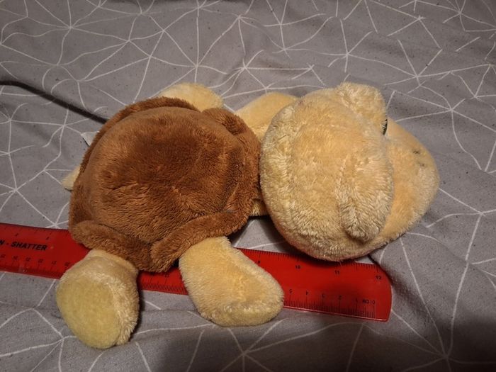 Turtle soft toy with large green eyes