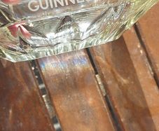 Guinness vintage heavy glass ashtray,,,collectors item, unusual with clear glass ,guinness logo on the 4 sides ,,see pictures for condition, sold as seen ,