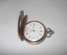 a gold plated pocket watch working by FOCUS swiss made