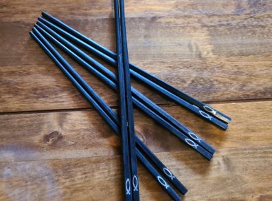 wooden chopsticks with metal fish embedded