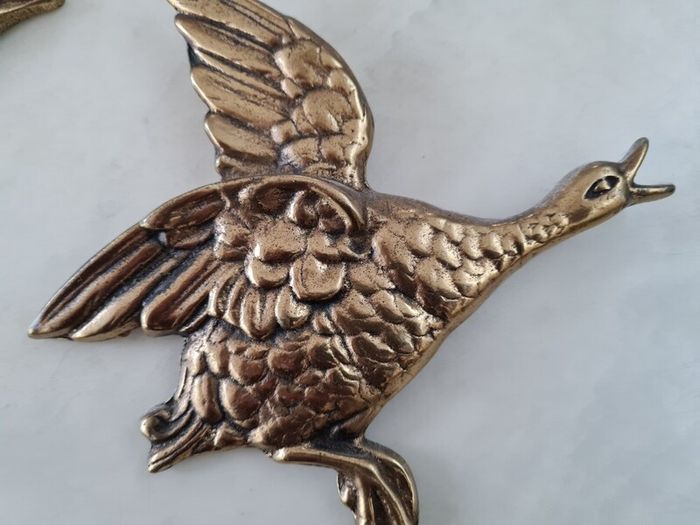 brass flying ducks