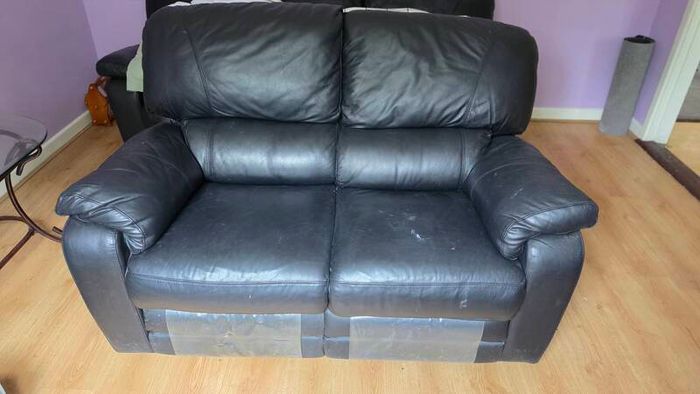 Two seater couch with recliners