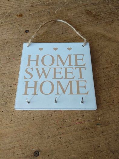 rustic wooden "Home Sweet Home" plaque  decorative wall art piece  small heart motifs, and metal hooks for keys