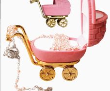 pink rosary beads in pram